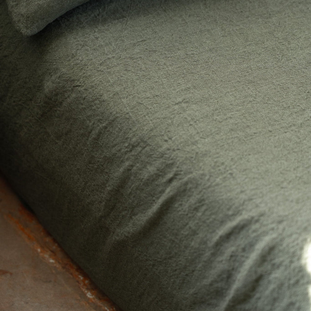 Close-up of a textured green FITTED SHEET