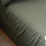 Close-up of a textured green FITTED SHEET